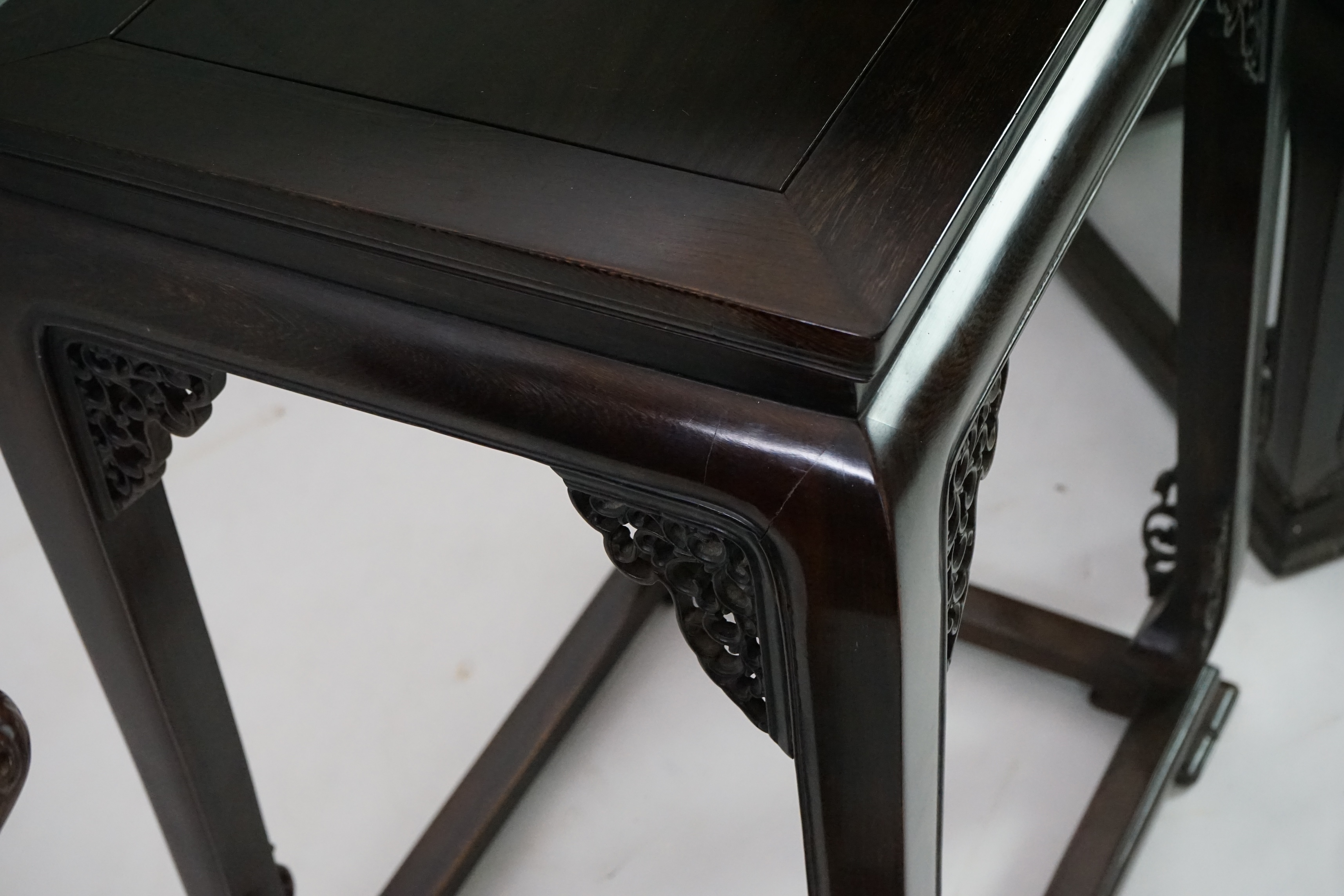 A pair of Chinese jichimu horseshoe shaped armchairs and a matching table, 19th/20th century